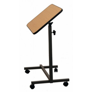 A TABLE ABOVE THE BED